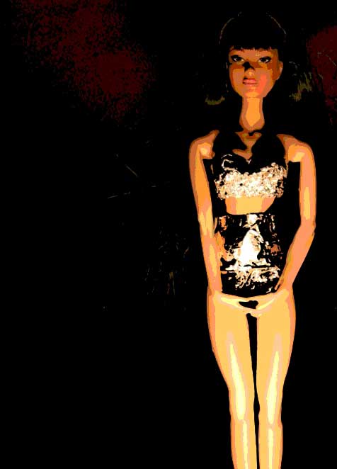 Photo of a doll-like woman in a black corset standing against a dark background
