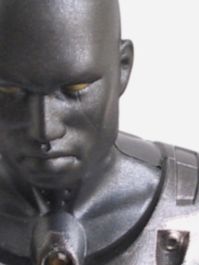 Close-up of a gray cyborg model's bald head and face