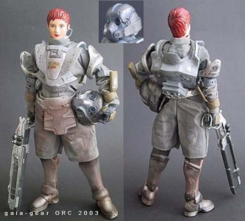 Front and back views of a red-haired female soldier action figure in gray armor holding a helmet and rifle
