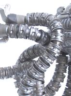 Detail of a model's segmented metal tentacles